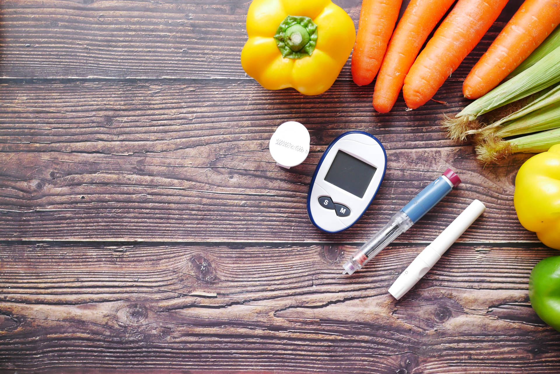 Diabetic testing supplies and a table of healthy food