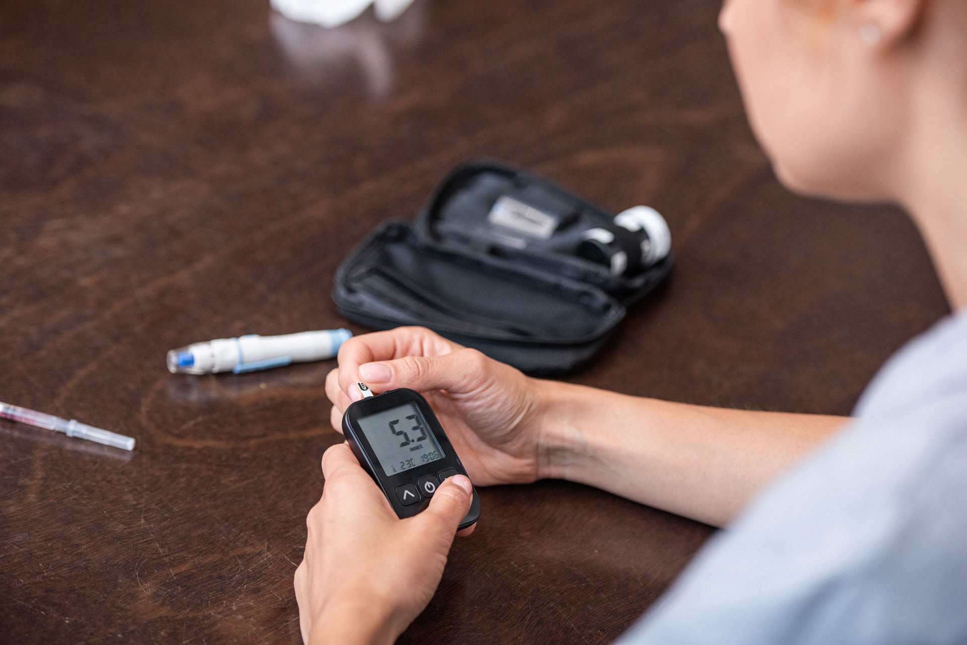 A patient with diabetes checks her blood glucose levels