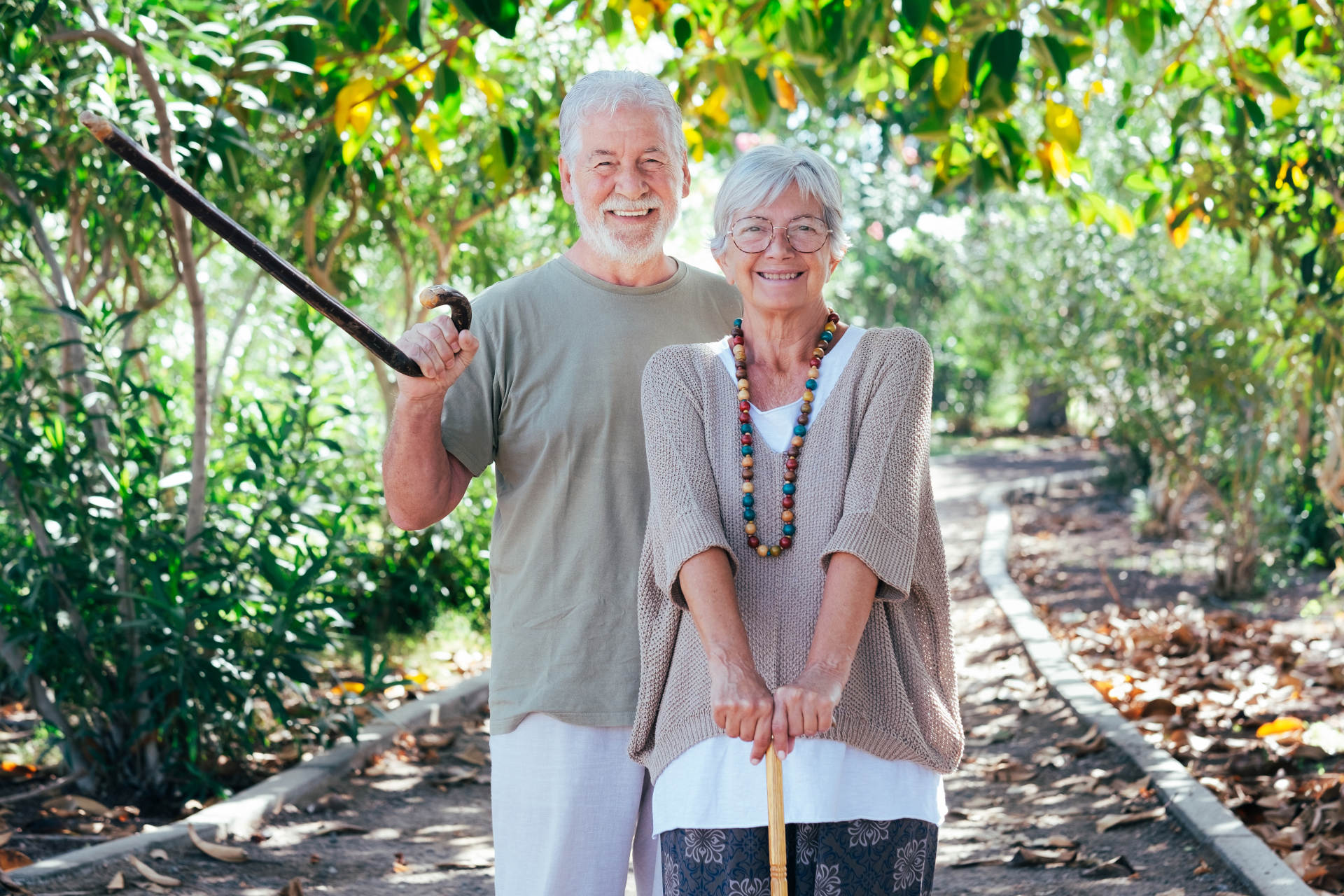 A senior couple walking outside together. 