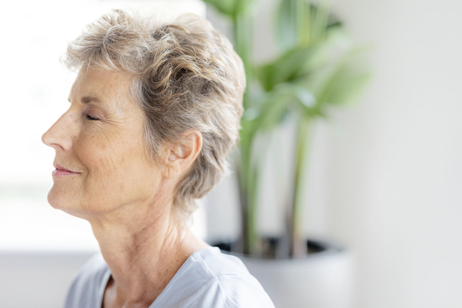 A senior woman breathing deeply